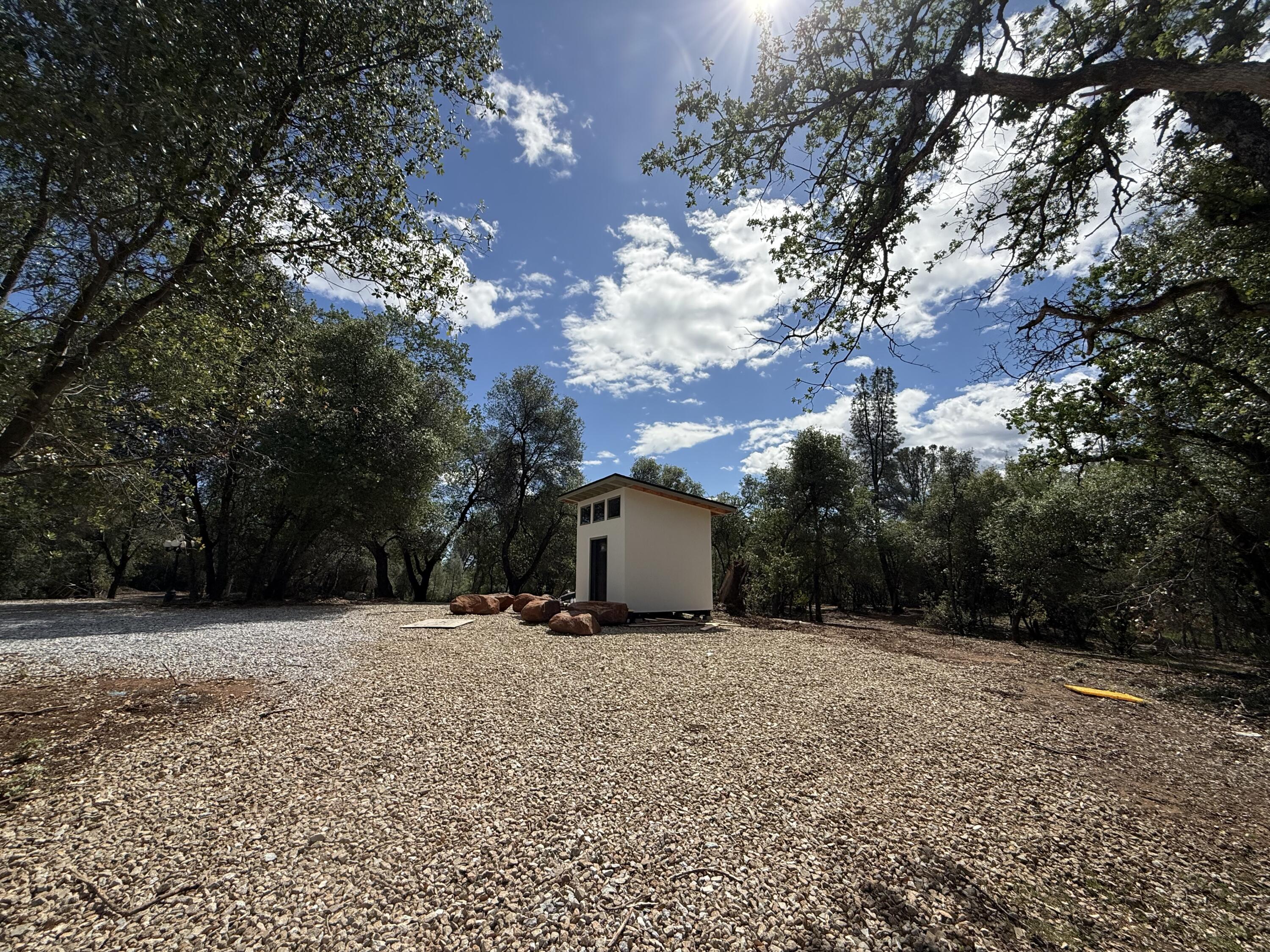 12333 Quartz Hill Road Redding, CA 96003 - Photo 7 of 21 a view of a white house with a yard