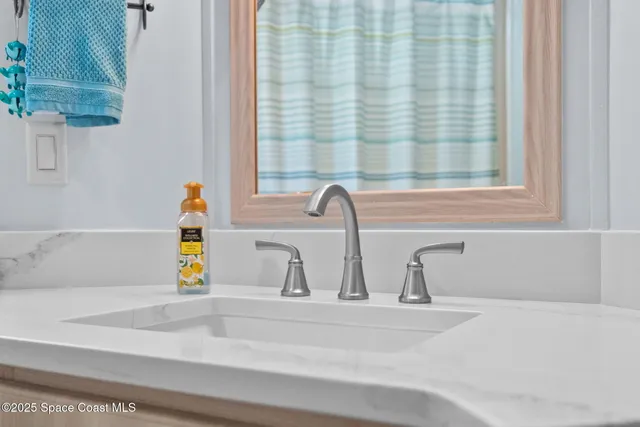 a view of an house with backyard and sitting area