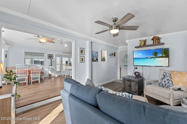 a view of workspace with wooden floor and windows