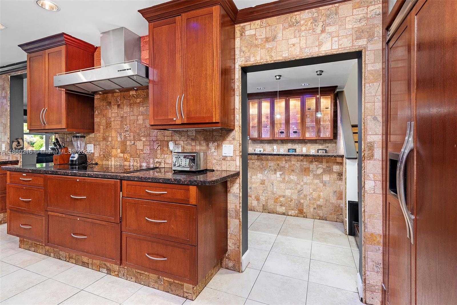 250 Northeast 158th Street Miami, FL 33162 - Photo 12 of 80 a kitchen with stainless steel appliances granite countertop a refrigerator and a sink