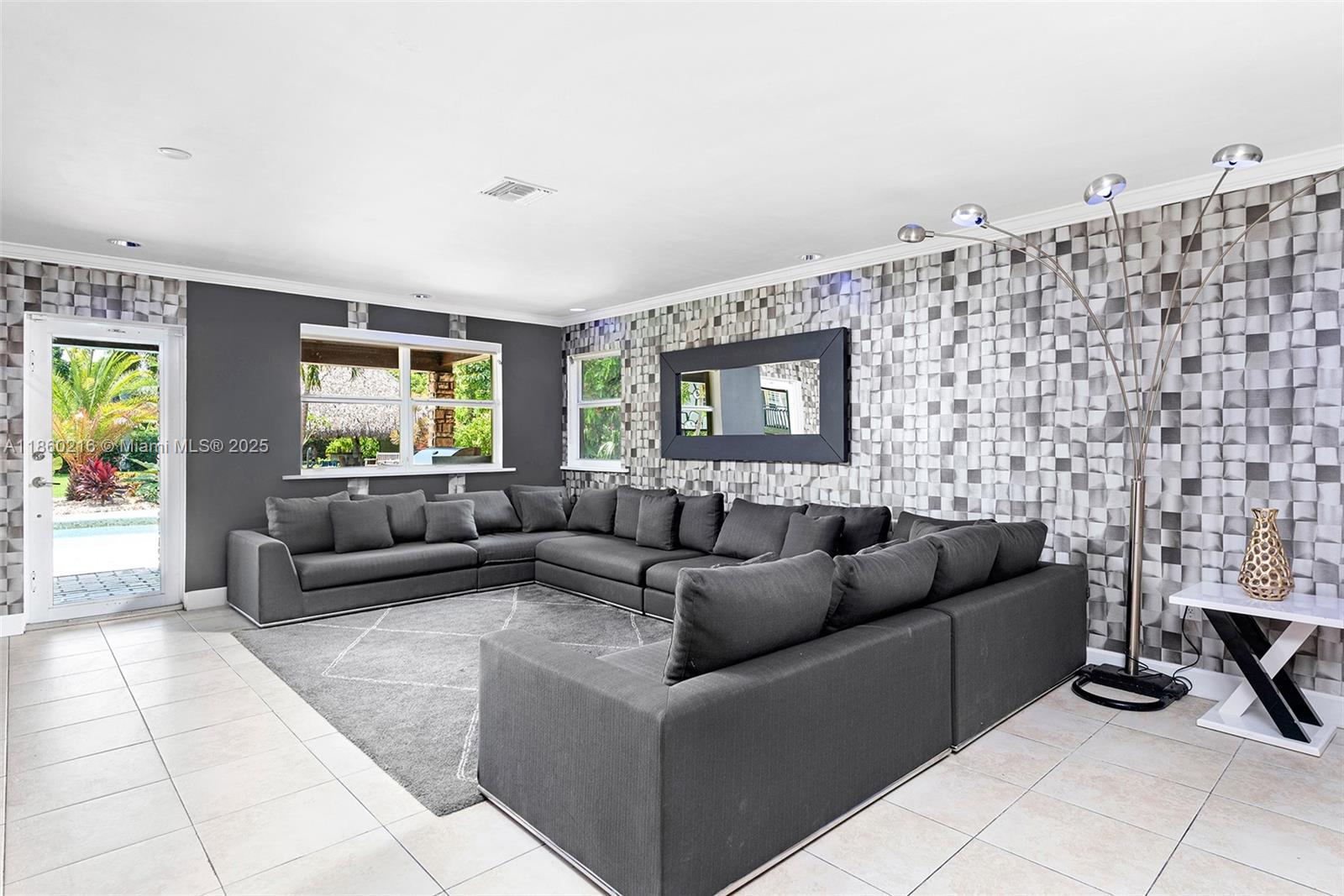 250 Northeast 158th Street Miami, FL 33162 - Photo 17 of 80 a living room with furniture and a fireplace