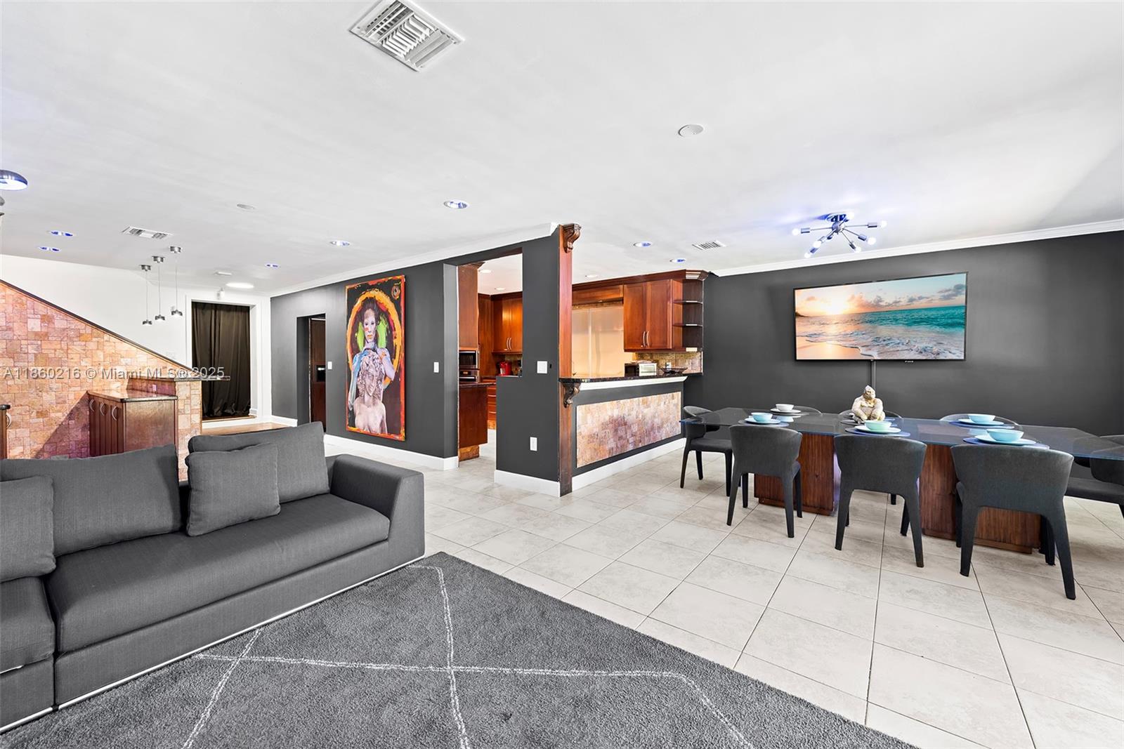 250 Northeast 158th Street Miami, FL 33162 - Photo 19 of 80 a living room with furniture and a flat screen tv