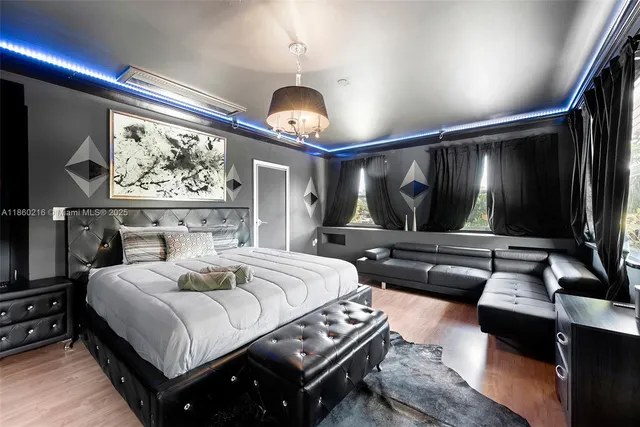 a bedroom with a large bed and a window