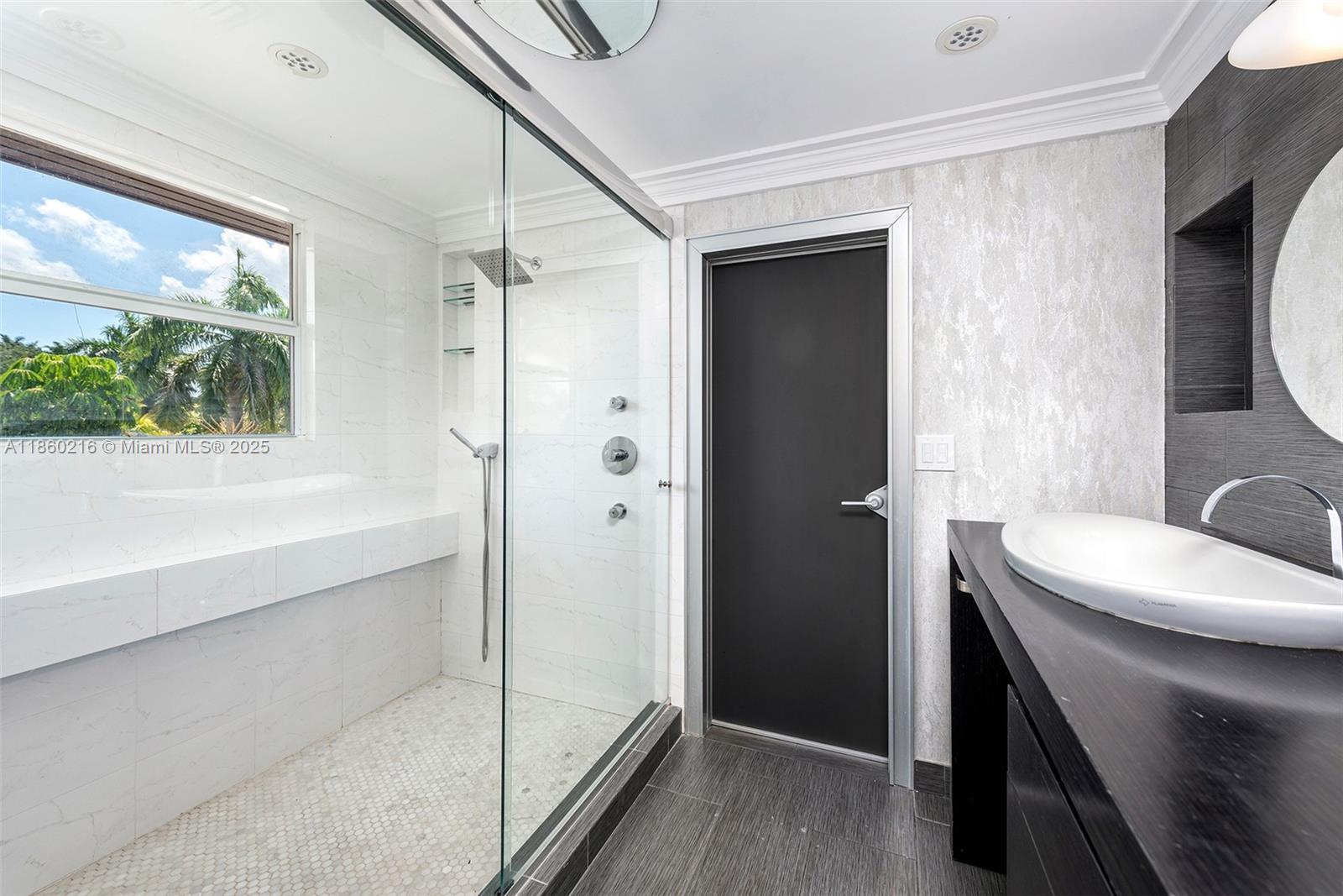 250 Northeast 158th Street Miami, FL 33162 - Photo 26 of 80 a bathroom with a sink and a mirror