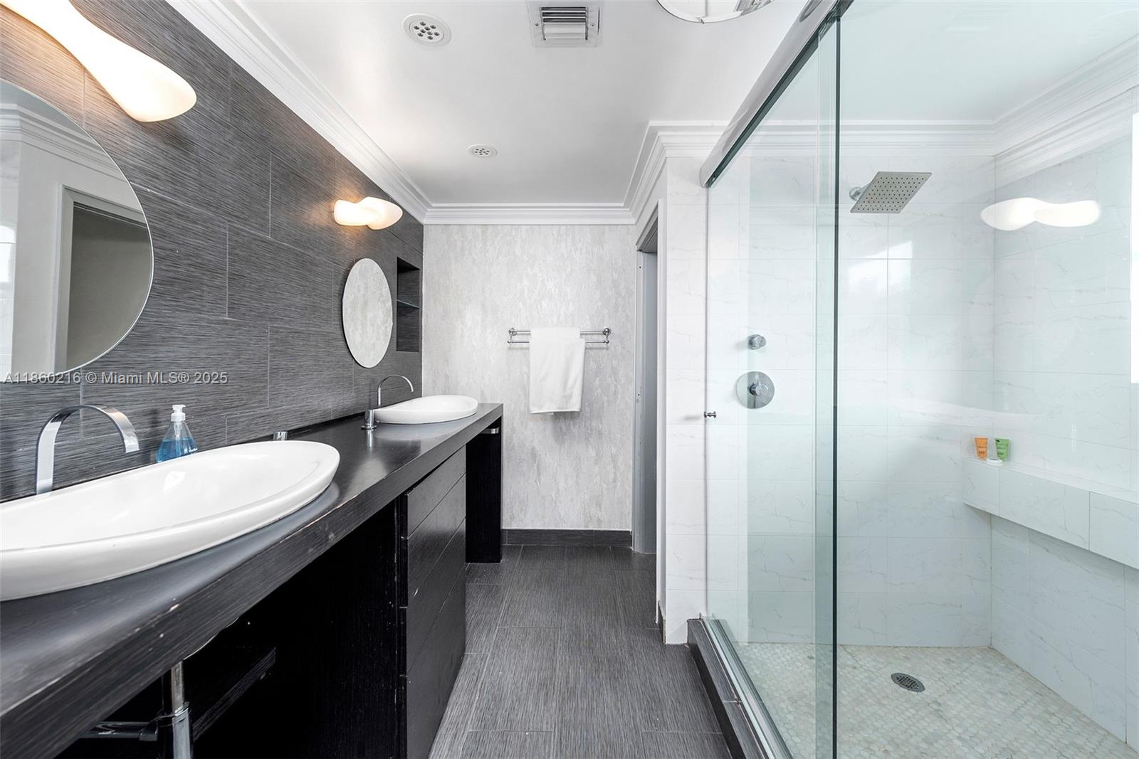 250 Northeast 158th Street Miami, FL 33162 - Photo 27 of 80 a bathroom with a sink a toilet and shower