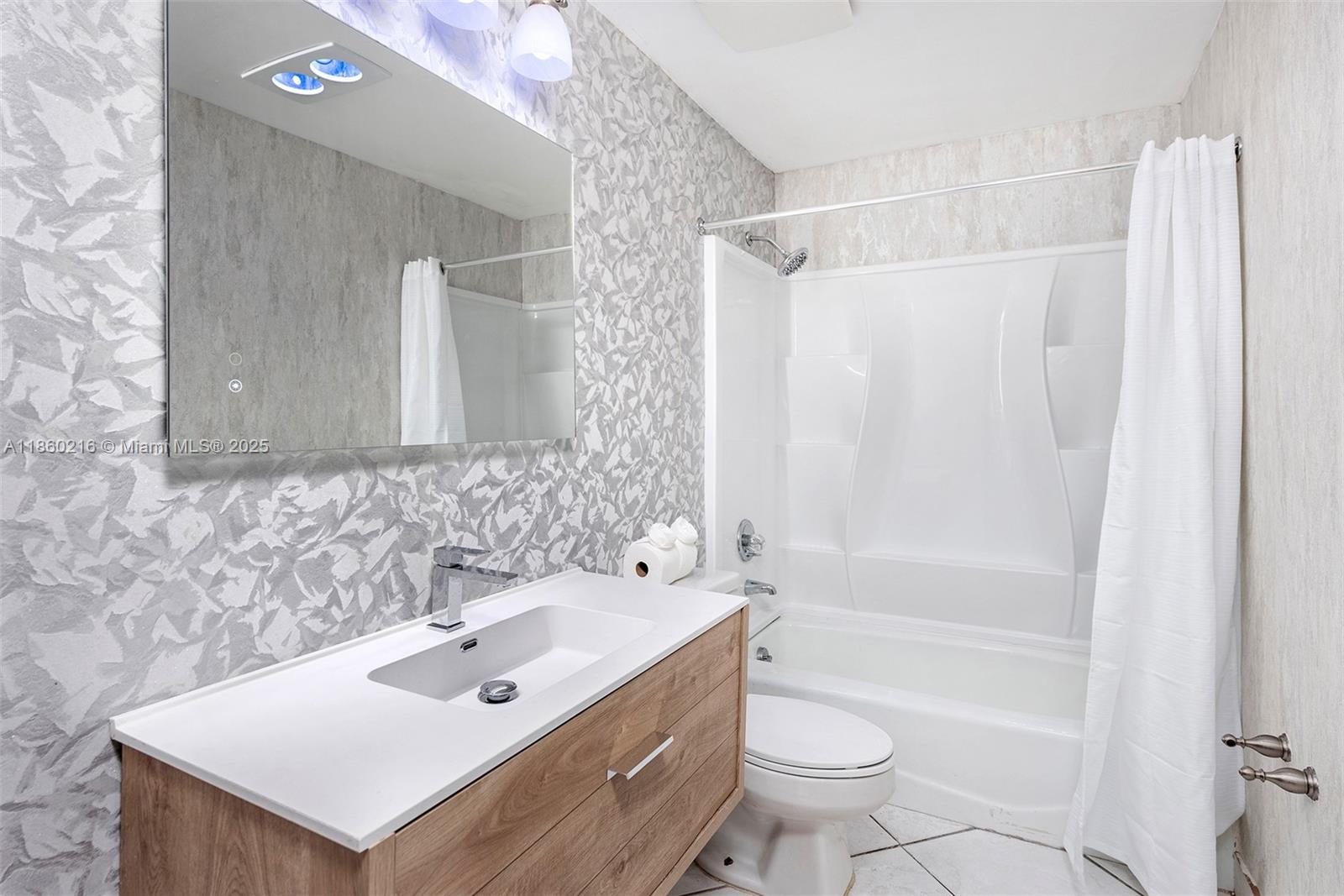 250 Northeast 158th Street Miami, FL 33162 - Photo 31 of 80 a bathroom with a sink toilet and shower