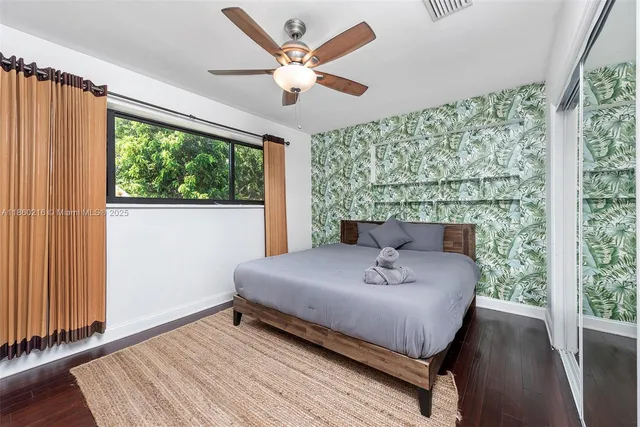 a dining room with furniture a rug and a chandelier