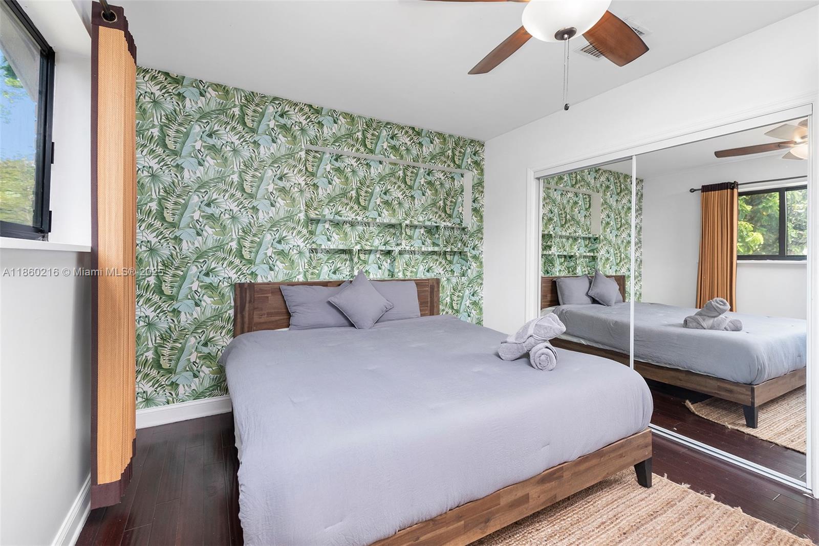 250 Northeast 158th Street Miami, FL 33162 - Photo 34 of 80 a bedroom with a large bed and a window