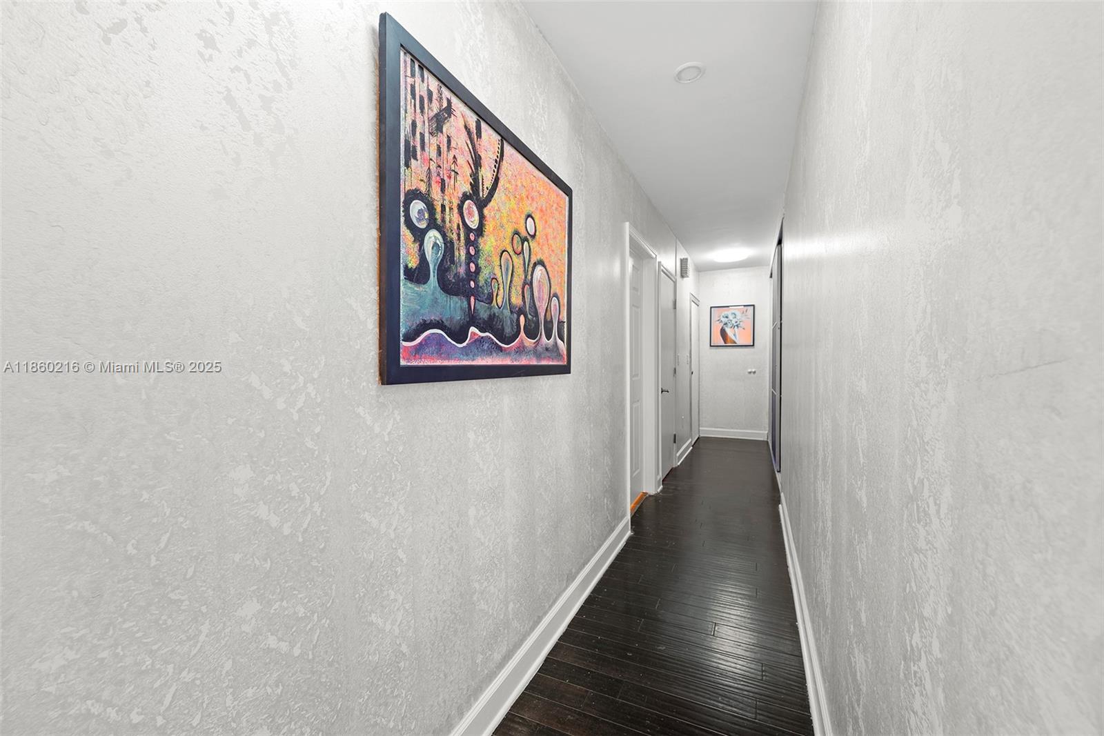 250 Northeast 158th Street Miami, FL 33162 - Photo 35 of 80 a view of a hallway with wooden floor