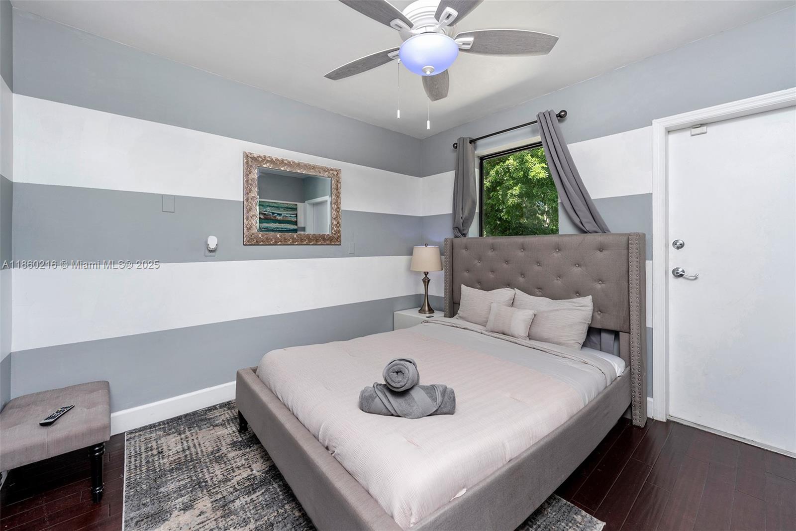 250 Northeast 158th Street Miami, FL 33162 - Photo 36 of 80 a bedroom with a bed and a window