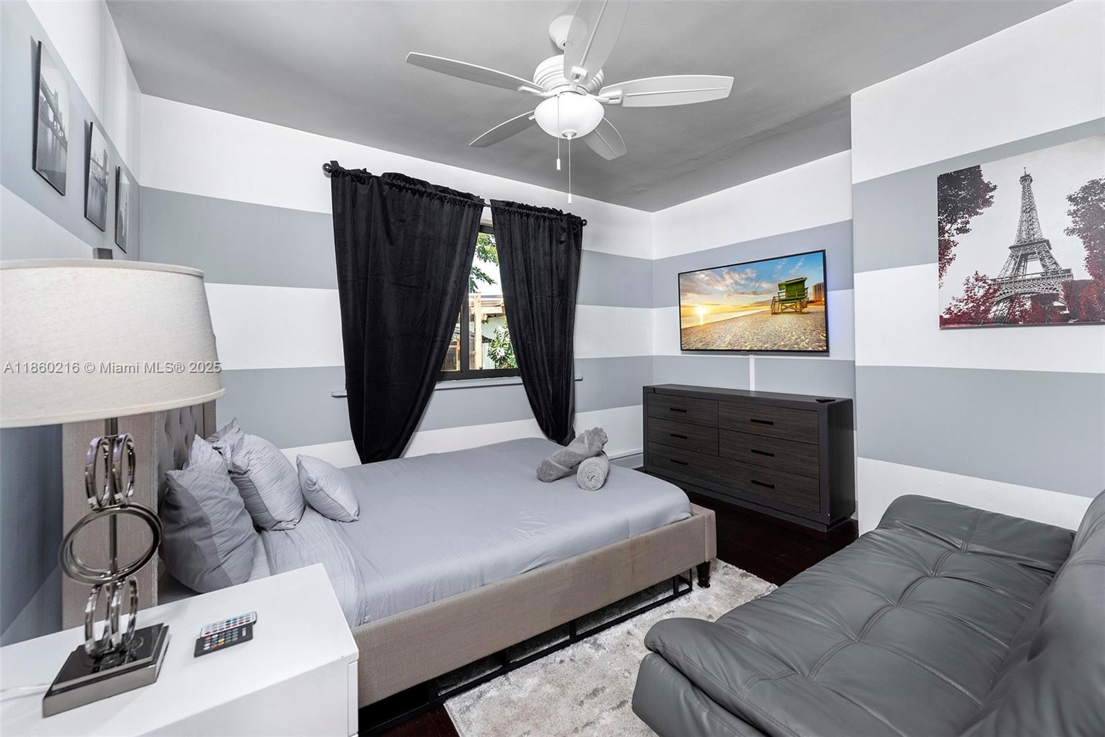 250 Northeast 158th Street Miami, FL 33162 - Photo 41 of 80 a living room with furniture and a flat screen tv