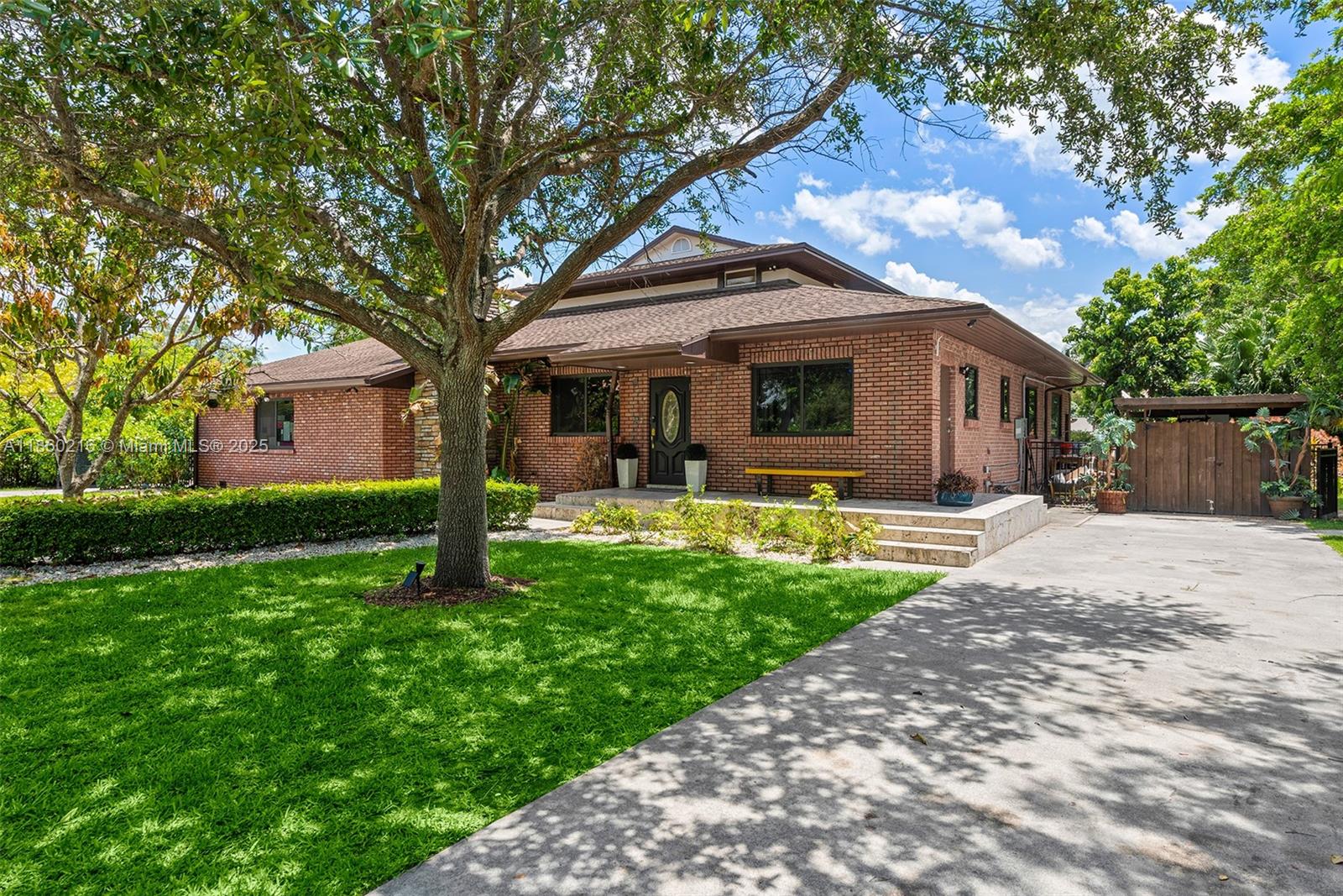 250 Northeast 158th Street Miami, FL 33162 - Photo 65 of 80 a front view of house with yard and green space