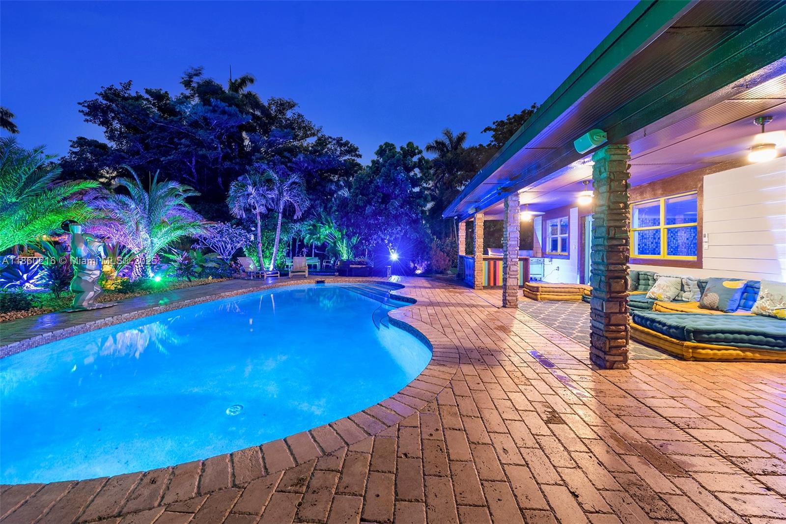 250 Northeast 158th Street Miami, FL 33162 - Photo 75 of 80 a view of swimming pool with outdoor seating