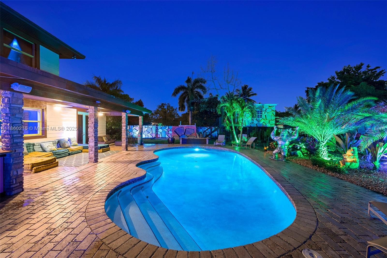 250 Northeast 158th Street Miami, FL 33162 - Photo 76 of 80 a view of a swimming pool with sitting area