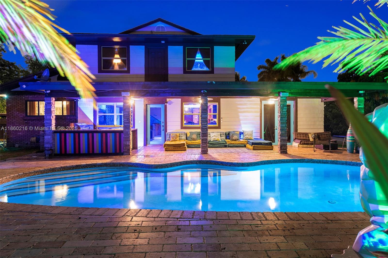250 Northeast 158th Street Miami, FL 33162 - Photo 77 of 80 a view of a swimming pool with an outdoor seating