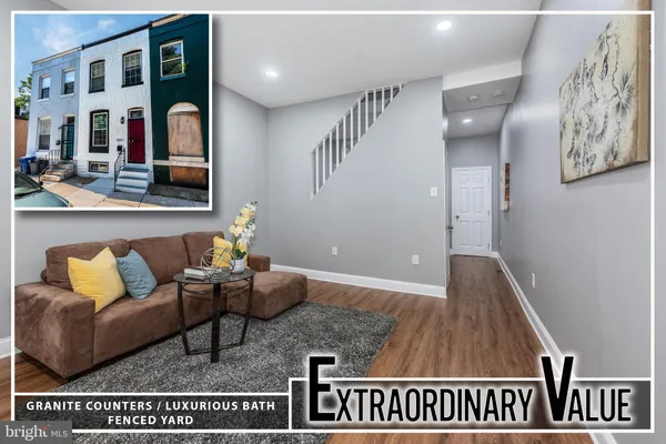 a living room with furniture and a rug