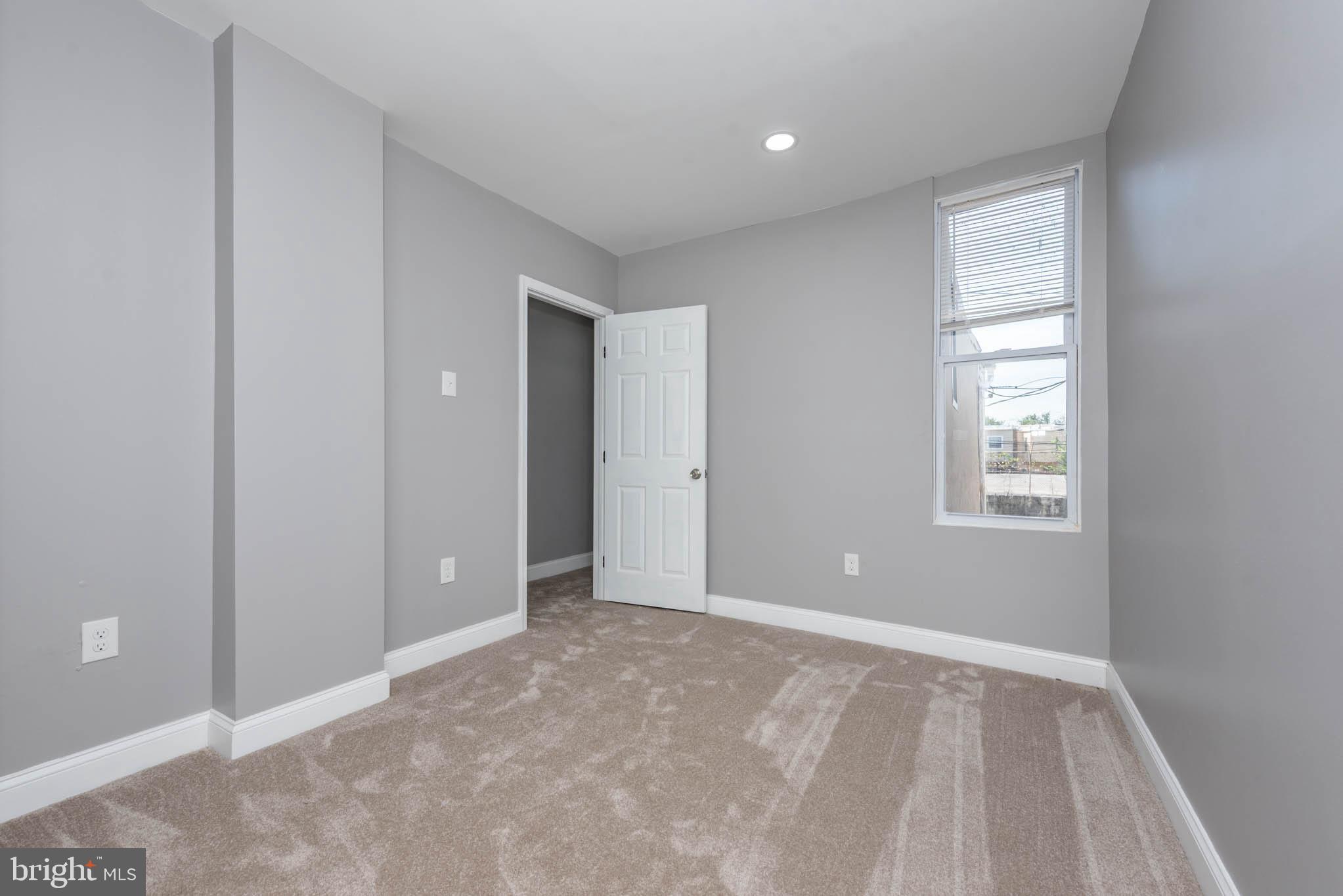 439 East 27th Street Baltimore, MD 21218 - Photo 14 of 30 a view of an empty room with window and closet area