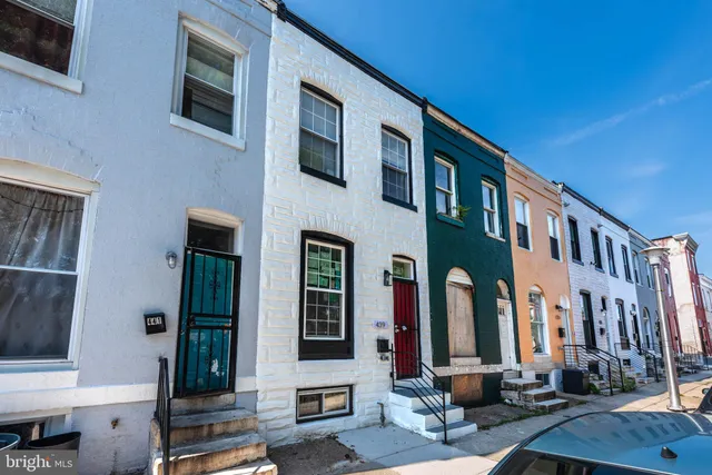 a front view of a building with glass windows