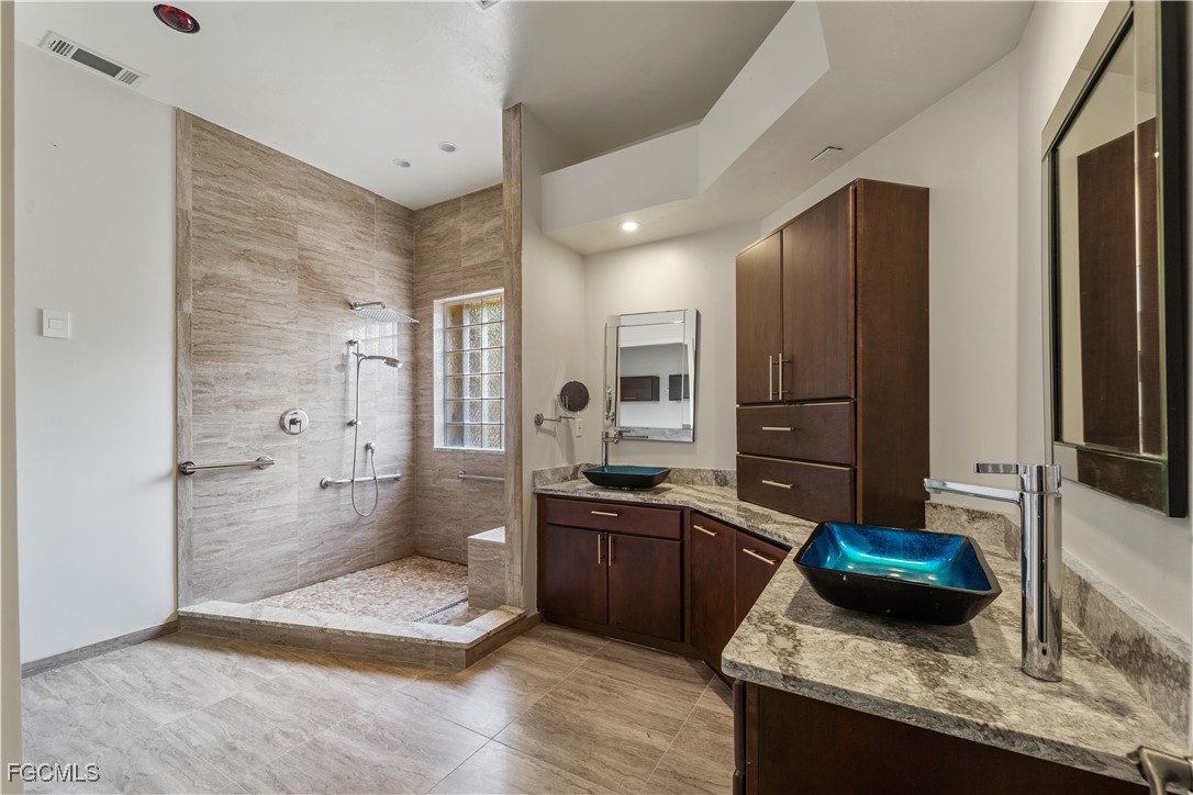 2050 Snyder Drive Alva, FL 33920 - Photo 33 of 49 a kitchen with stainless steel appliances granite countertop a sink stove and refrigerator