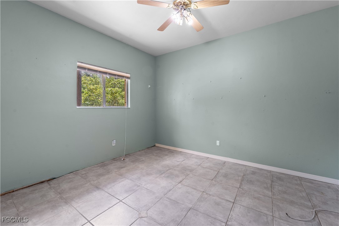 2050 Snyder Drive Alva, FL 33920 - Photo 41 of 49 an empty room with a chandelier fan