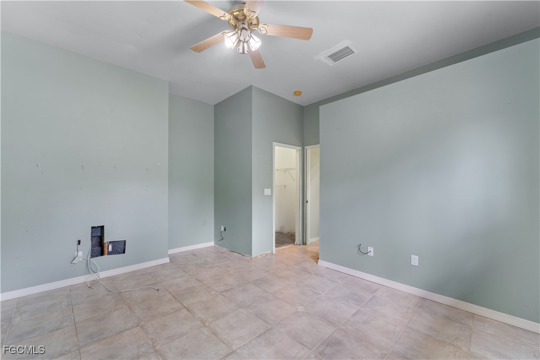 2050 Snyder Drive Alva, FL 33920 - Photo 42 of 49 a view of an empty room with a chandelier fan