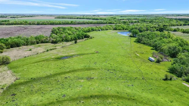 a view of a garden with a building in the background