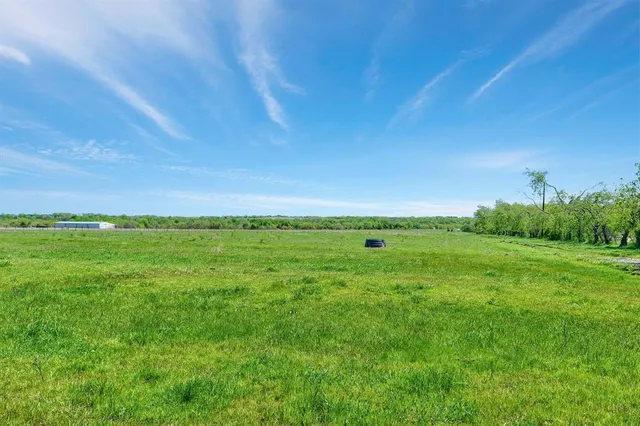 a view of a road with a building in the background