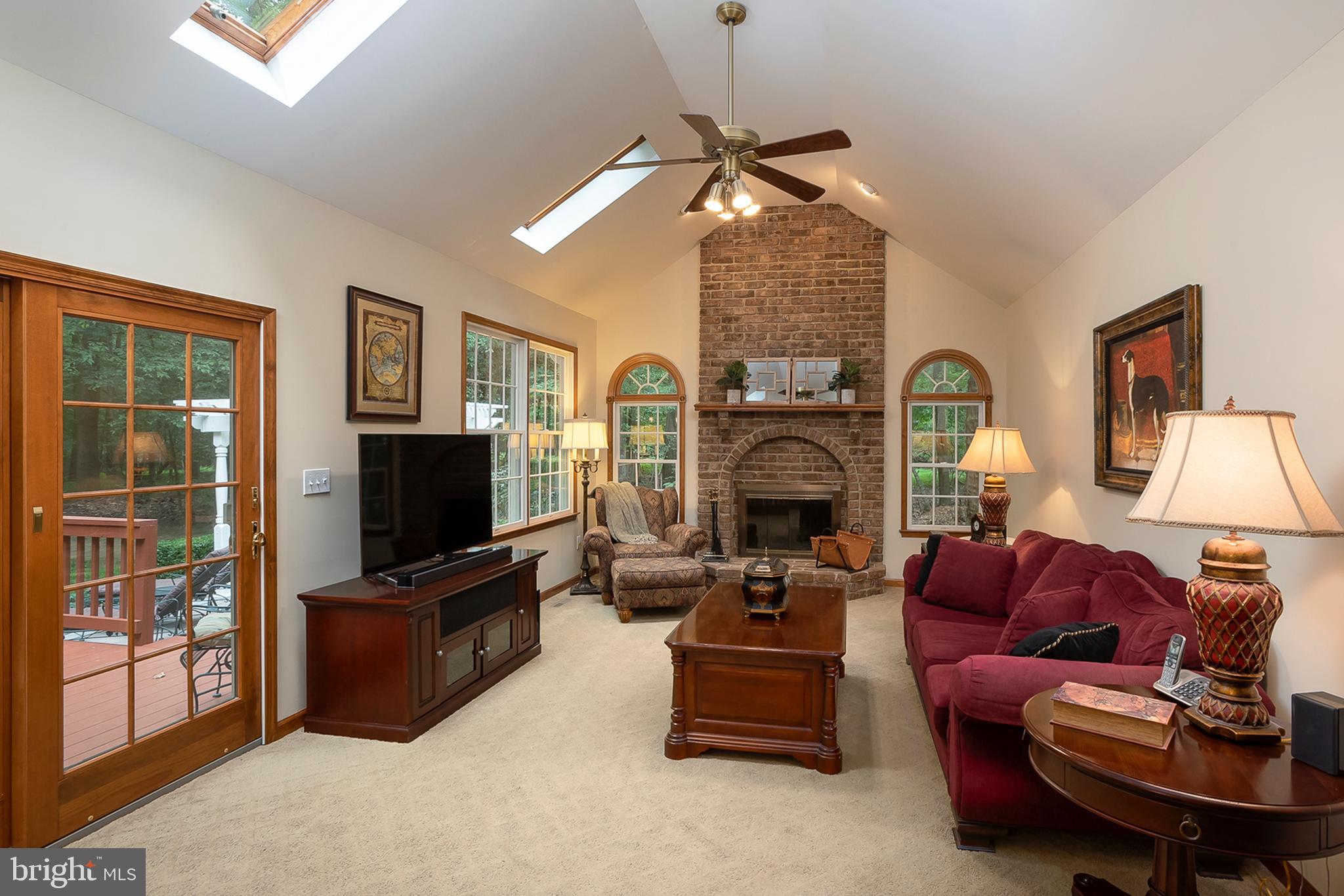 3165 Florence Road Woodbine, MD 21797 - Photo 16 of 42 Family room w/ toasty fireplace and access to deck