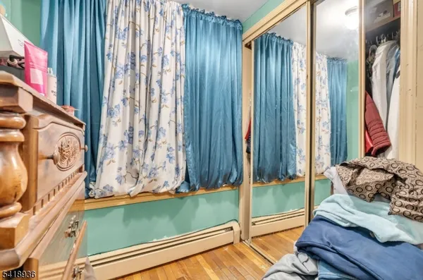 a view of bedroom with a bed and a window