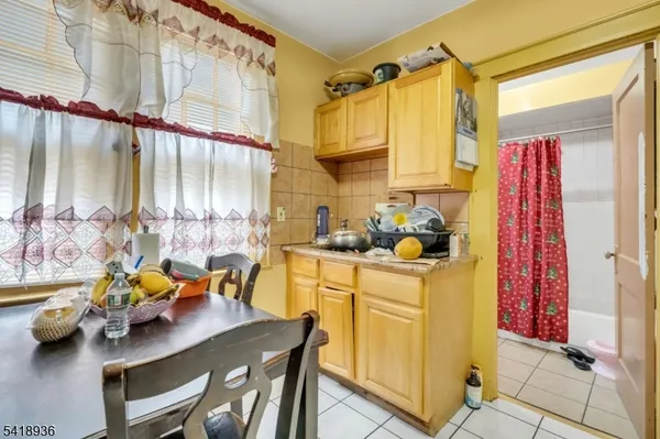 a kitchen with stainless steel appliances kitchen island granite countertop a sink and cabinets