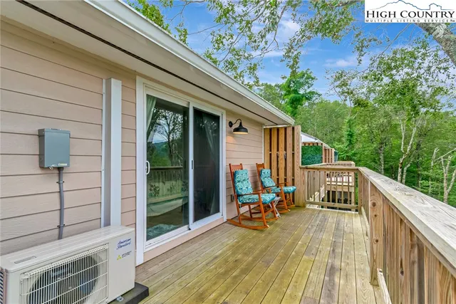 a view of deck with wooden floor and outdoor seating