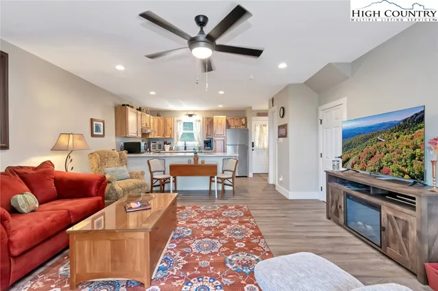 a living room with furniture and a flat screen tv