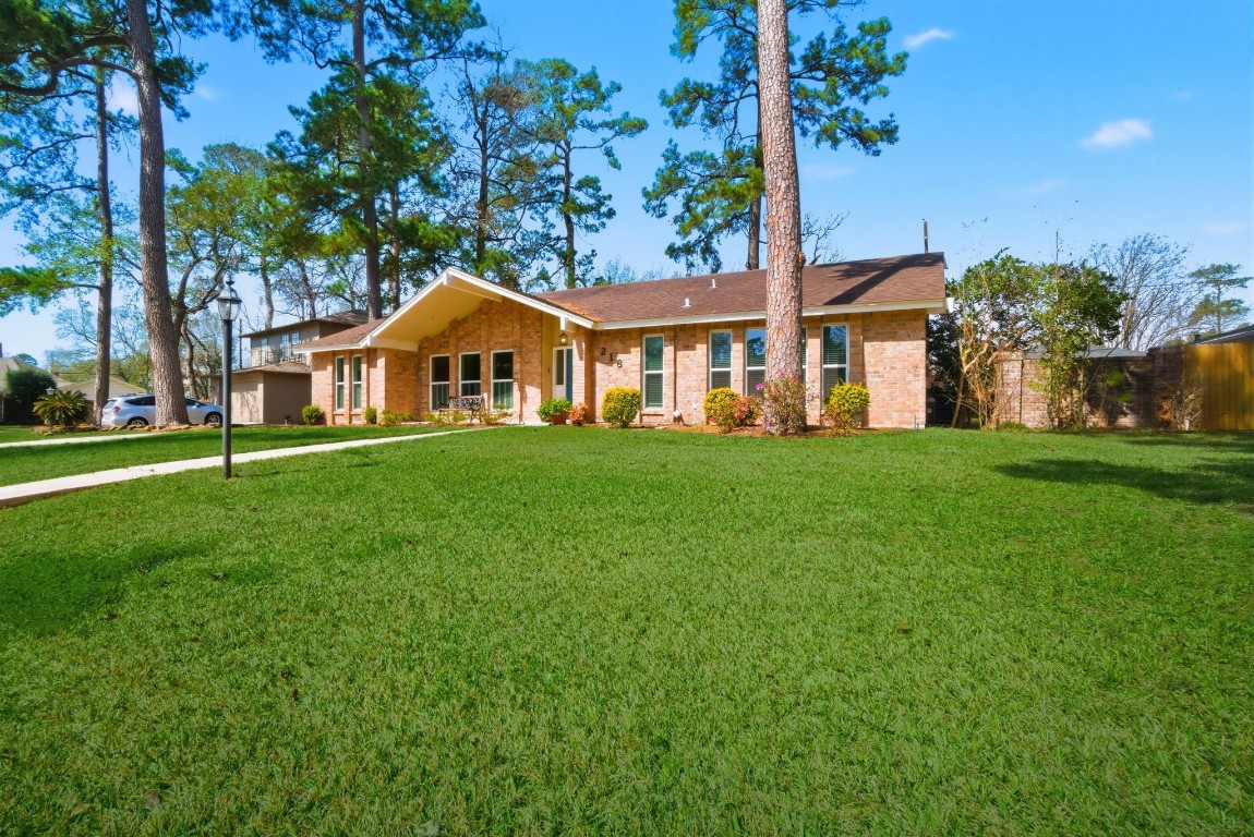 218 Tree Trunk Drive Spring, TX 77388 - Photo 2 of 40 Large front yard. (Enhanced grass)
