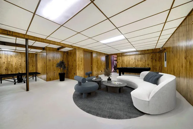 a very nice looking bedroom with a large window