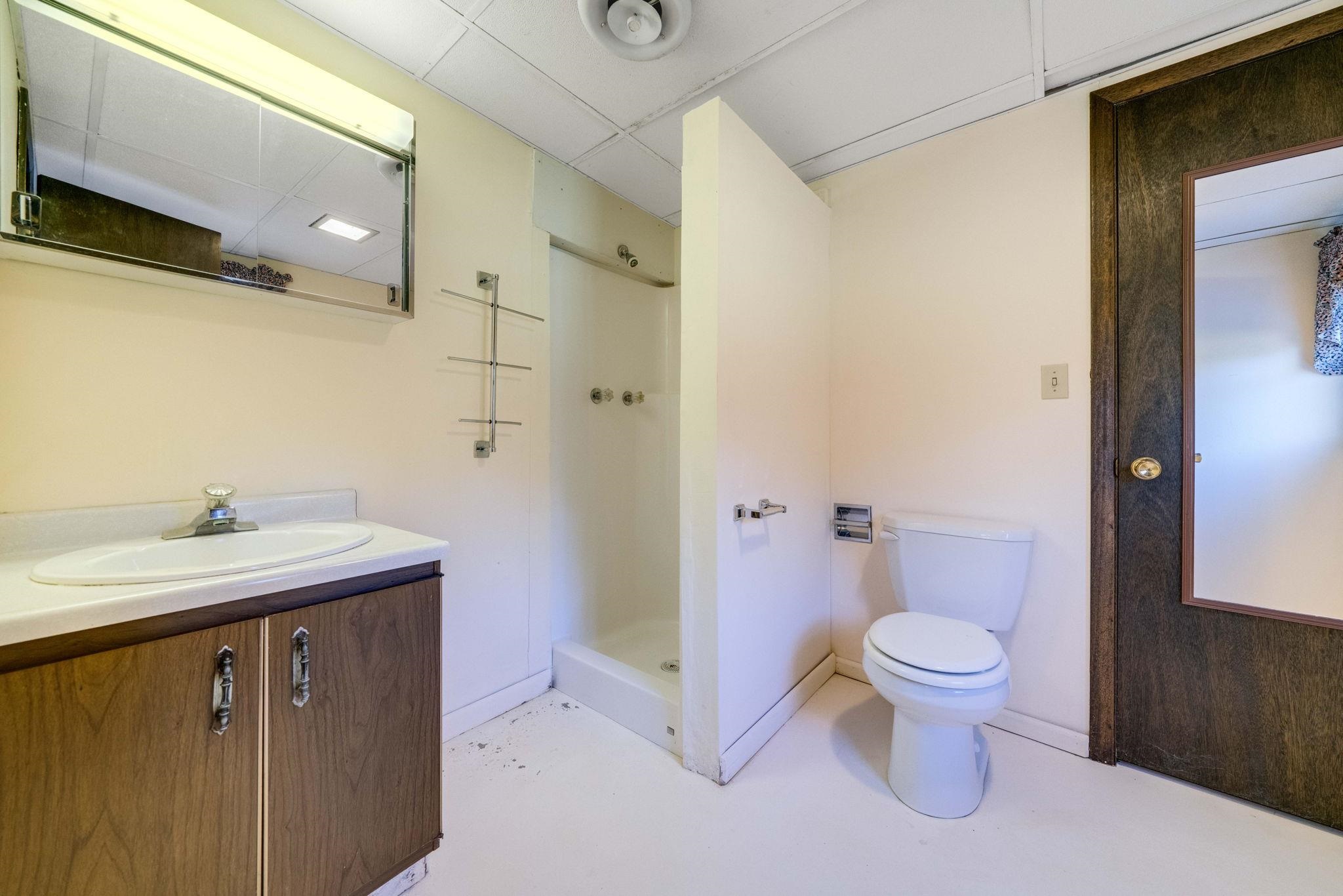 1198 Riverside Road Belvidere, IL 61008 - Photo 24 of 35 a bathroom with a sink toilet and shower