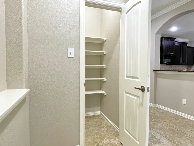 a view of a hallway with closet