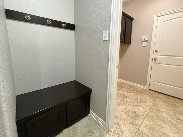 a view of a kitchen with a refrigerator