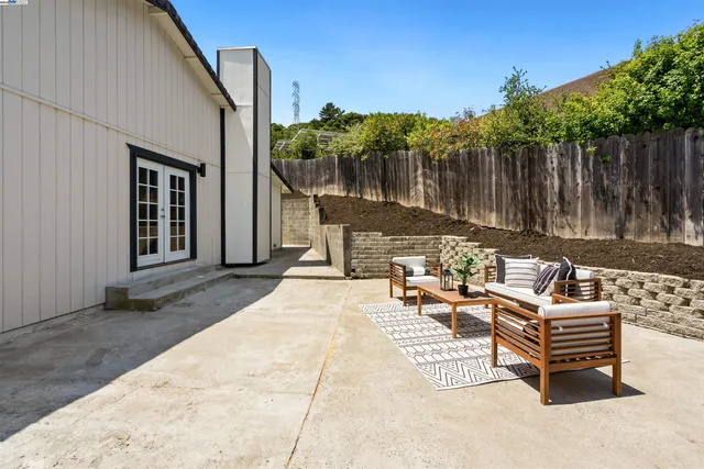 a view of a dinning tables and chairs in patio of the house