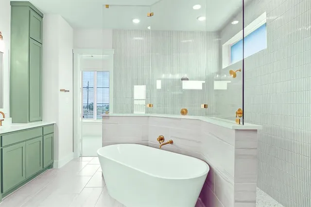 a bathroom with a bathtub and a sink