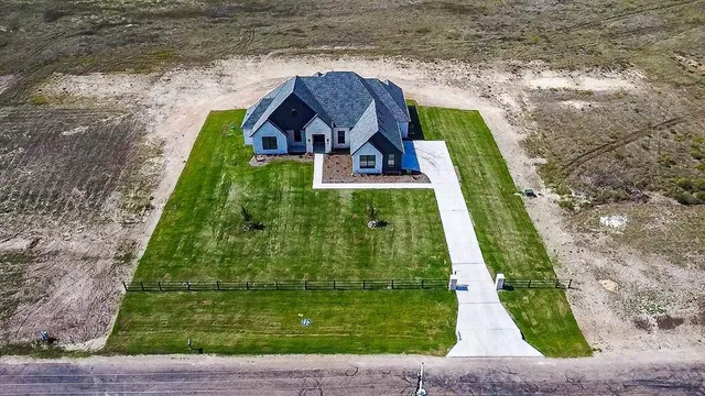 a view of swimming pool with a yard