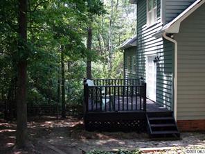 3077 Point Clear Drive Tega Cay, SC 29708 - Photo 5 of 5 a view of a brick house with a small yard