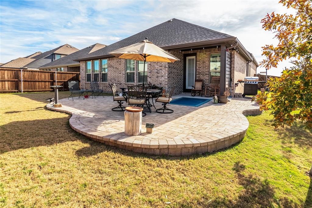1363 Tecoma Trail Justin, TX 76247 - Photo 1 of 1 a view of a house with swimming pool and sitting area