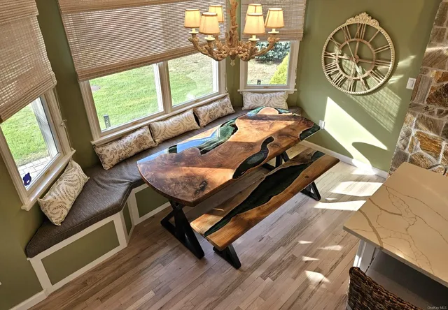 a white bath tub sitting in a bathroom next to a window