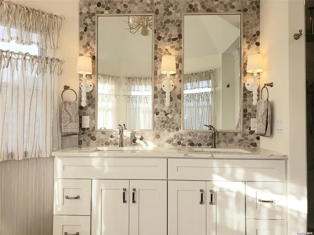 a bathroom with a sink and a shower