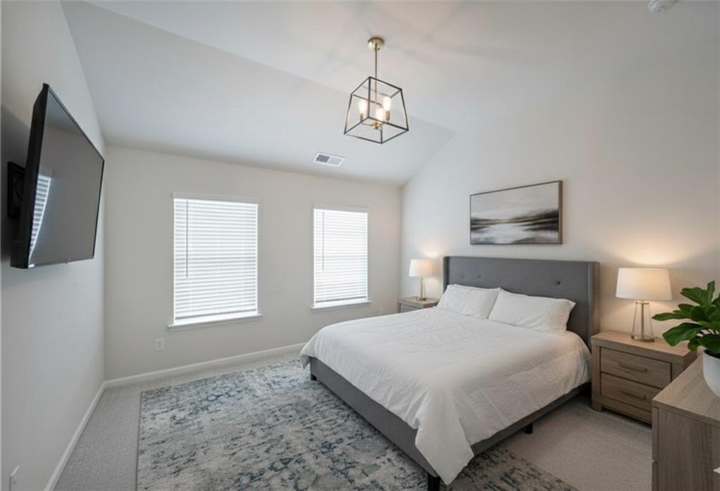 4450 Richmond Court Stone Mountain, GA 30083 - Photo 21 of 31 a bedroom with a large bed and a window