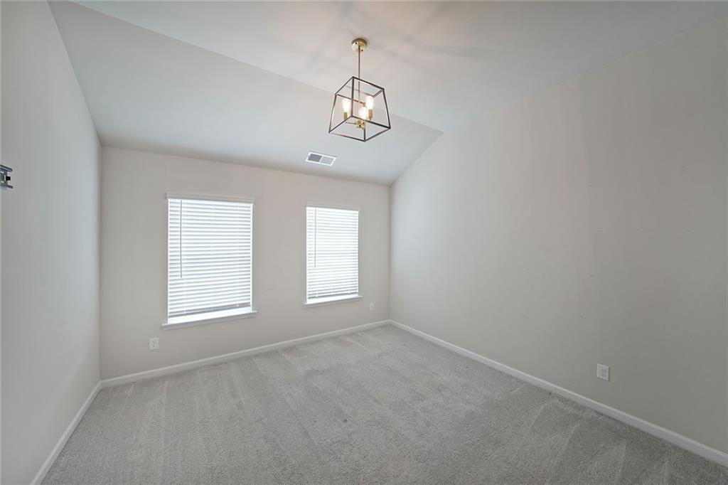 4450 Richmond Court Stone Mountain, GA 30083 - Photo 22 of 31 an empty room with windows