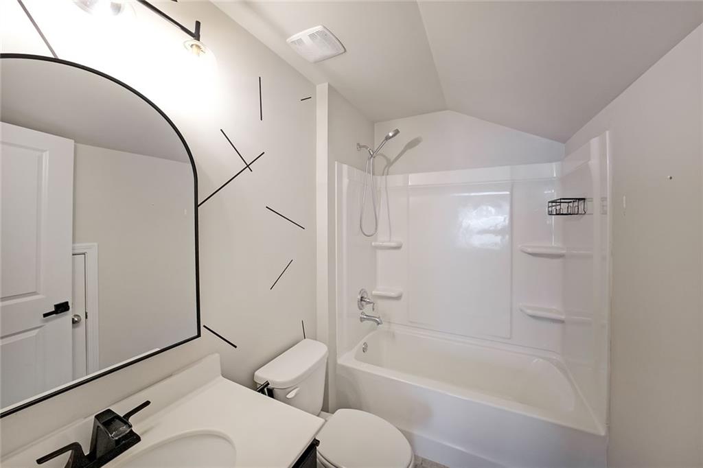 4450 Richmond Court Stone Mountain, GA 30083 - Photo 28 of 31 a bathroom with a sink toilet and shower