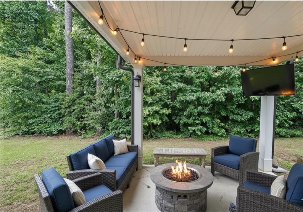 4450 Richmond Court Stone Mountain, GA 30083 - Photo 30 of 31 a view of a patio with couches chairs and a table