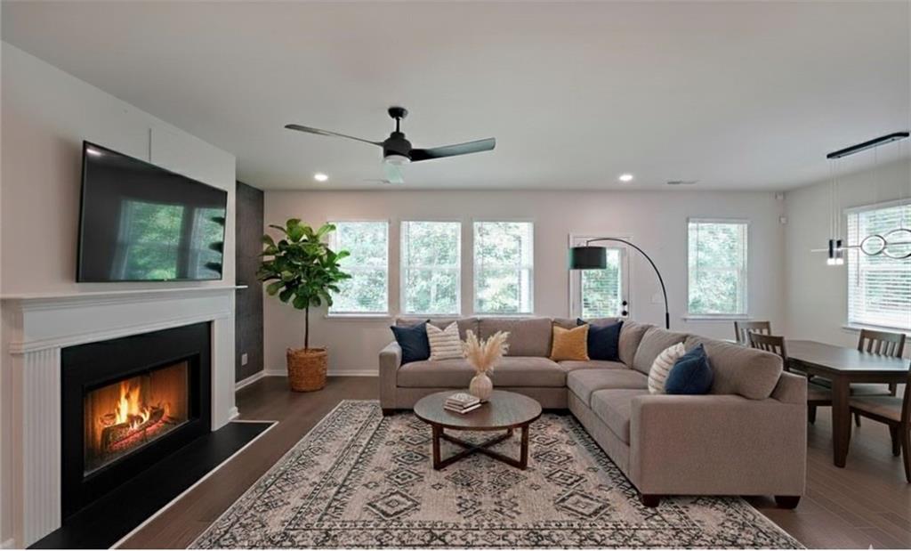 4450 Richmond Court Stone Mountain, GA 30083 - Photo 4 of 31 a living room with furniture and a fireplace
