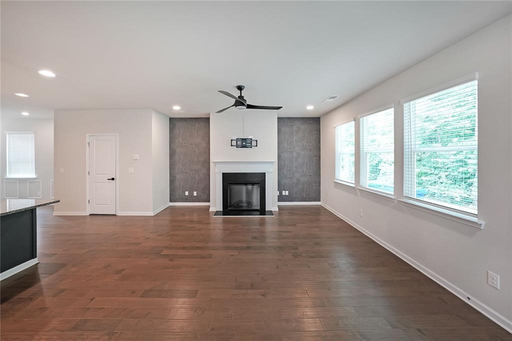 4450 Richmond Court Stone Mountain, GA 30083 - Photo 7 of 31 an empty room with windows and fireplace
